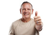 © Harsh/peopleimages.com - PNG shot of a handsome mature man standing against a grey background in the studio and making a thumbs up gesture