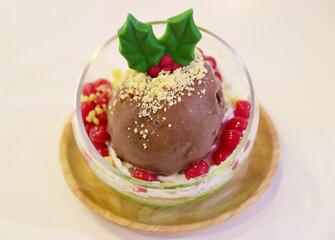 Wall Mural - Closeup of Mouthwatering Christmas Ornament Shaped Chocolate Ice Cream in a Glass Bowl