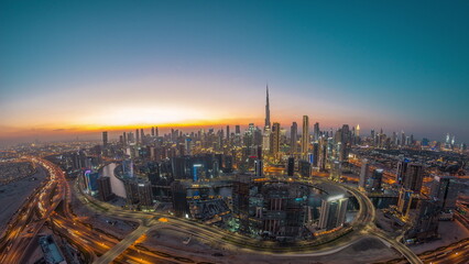 Poster - Panoramic skyline of Dubai with business bay and downtown district day to night timelapse.