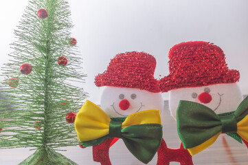 Wall Mural - Christmas festive glasses with snowmen with bow ties with brazil colors, Christmas concept in brazil