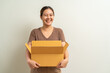 © littlestocker - Asian women holding parcel box package, shipment service and delivery courier concept