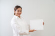 © littlestocker - Happy asian woman holding white board. Advertising copy space