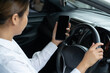 © littlestocker - Asian women using smartphone while driving