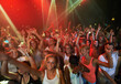 © Arcurs Co-op/peopleimages.com - Concert music, rock and crowd of people with disco party lights for dance, performance and singing together in psychedelic festival. Night club, techno and rave with group of people or youth dancing