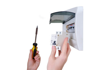 a woman changes an automatic fuse in a home electrical panel, isolated on a white background. self r