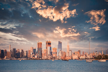Wall Mural - New York City skyline with skyscrapers, new construction, Hudson River  and sunset as seen from New Jersey