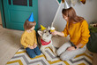 Dog pet birthday party, Happy family mother and child congratulating pet with birthday cupcake happy birthday