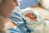 Mother with her newborn baby at the hospital a day after a natural birth labor