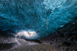 © Erika Valkovicova - Blue ice cave with icicles in Iceland