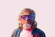 © ADDICTIVE STOCK - Senior male in led rave glasses in studio