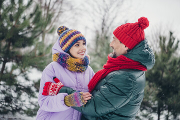 Wall Mural - Photo of excited charming husband wife wear windbreaker cuddling dancing together outside urban city park