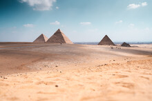 Sandy Desert Terrain With Pyramids