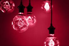 Group Of Red Lamps With Interesting Shape Of Tungsten Filament And Red Light. Demonstrating Viva Magenta - Trendy Color Of The Year 2023