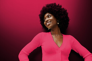Happy African young woman with hair. Color of the year 2023, viva magenta.