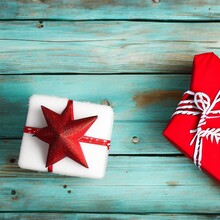 Christmas Gifts Box And Snow On Old Wooden Background.png