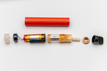 Disassembled Electronic Cigarette On A White Background, The Constituent Elements Of Viper.