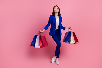 Wall Mural - Photo of funny pretty positive lady wear stylish clothes outfit rejoice purchases empty space isolated on pink color background