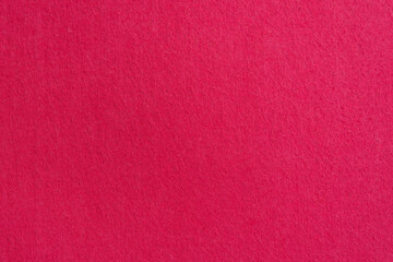 Wall Mural - Close-up texture of natural scarlet or pink fabric. Cloth as background. Bright material for design