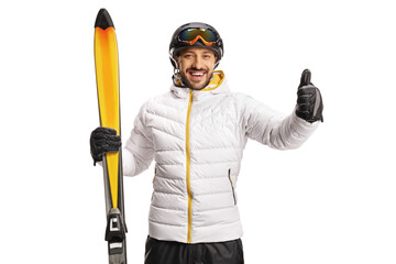 Sticker - Cheerful male skier holding skiis and showing thumbs up