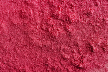 Powder surface close-up, magenta color abstract background