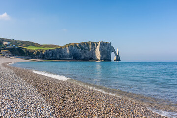 Wall Mural - Scenic view of Etretat coast in Normandy France with calm sea against clear blue sky