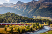 Swiss Train In The Alps And River Around Bernina Pass, Engadine, Switzerland