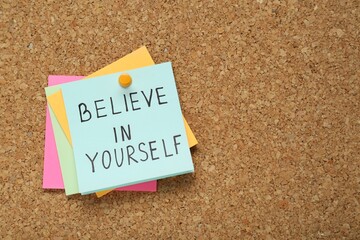 Wall Mural - Notes with phrase Believe In Yourself and space for text on corkboard, top view. Motivational quote