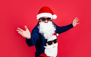 Wall Mural - santa claus bearded man in glasses wish happy new year and merry christmas holiday ready to celebrate winter party with fun and joy full of xmas presents and gifts, greeting