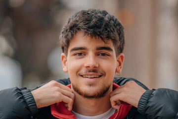 Wall Mural - young man on the street in autumn winter