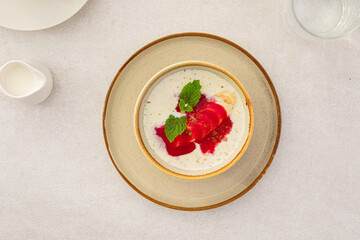 Wall Mural - Portion of healthy sweet porridge with banana and jam