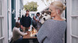 © Kobus L/peopleimages.com - Love, dog hug and woman at a house party, happy celebration and friends in a backyard during a holiday. Social content, lunch and girl with a husky puppy at a home dinner in a garden with people