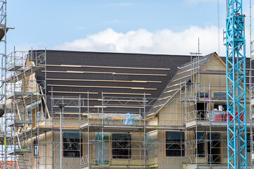 Wall Mural - Image of Unfinished roof timber frames being built for modern scandinavian apartment house