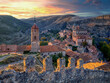 Views of Albarracin at sunset with its walls and the church of Santa Maria y Santiago.