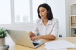 © SHOTPRIME STUDIO - Woman business works at her laptop at home in her office, freelance employee in business