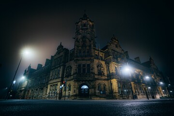 Poster - Beautiful building with security lights in the night.