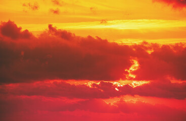 Poster - Dramatic cloudy sky at sunset. Orange red gradient color. Sky texture, abstract nature background