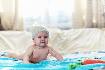 Wall Mural - The little baby is lying on the crib. Newborn.