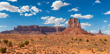 Monument Valley Iconic Rock Formations Under Cloudy Blue Sky. Navajo Tribal Park , Arizona - Utah, USA