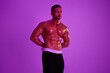 © SHOTPRIME STUDIO - Man athletic body bodybuilder in briefs with nude torso abs full-length in the background fitness classes, purple colored light. Advertising, sports, active lifestyle, competition, challenge concept.