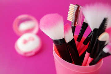 makeup brushes, woman make up product, Fashion beauty cosmetic on a pink background,copy space