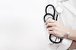 © marketlan - Doctor holding a phonendoscope or stethoscope in his hand with copy space