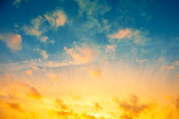 Poster - Colorful cloudy sky at sunset. Blue yellow gradient color.
