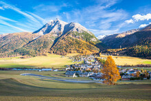 Scenic Autumn Image Of Engadin Valley In The Swiss Alps With The Village Of La Punt-Chamues-ch