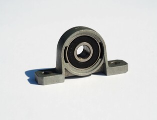 Metal ball bearing in housing. Two bolt flanged housing unit. Metal ball bearing pillow block