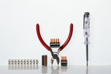 Wall Mural - Different tools for electronics repair laid out on a white background