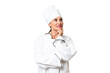 © luismolinero - Middle-aged chef woman over isolated background thinking an idea while looking up