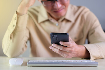 Poster - Man using smartphone at home. businessman texting on mobile phone in room. Communication, home work or study, connection, mobile apps, technology, lifestyle concept