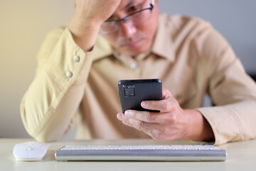 Poster - Man using smartphone at home. businessman texting on mobile phone in room. Communication, home work or study, connection, mobile apps, technology, lifestyle concept