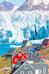 Wall Mural - Picturesque village on coast of Greenland - Colorful houses in Tasiilaq, East Greenland