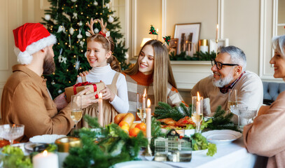 Sticker - Happy big family with children exchanging gifts on Christmas morning at home